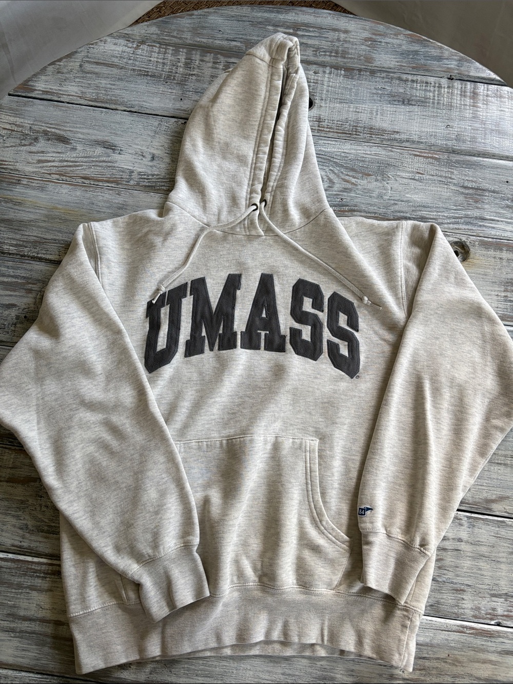 In excellent condition, grey UMASS hoodie sweatshirt, size M